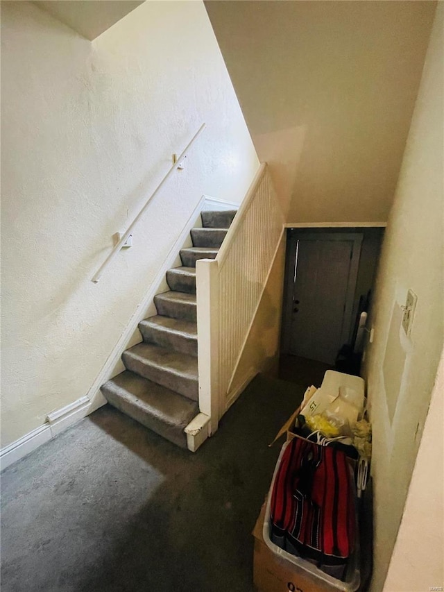 4934 W Florissant Ave, Saint Louis, MO 63115 - stairs featuring carpet flooring and baseboards