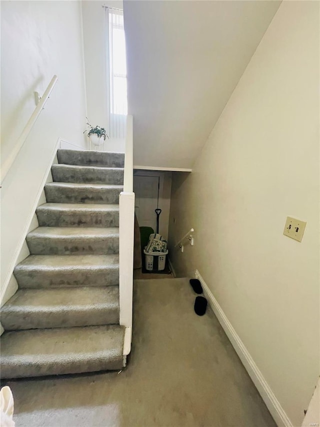 4926 W Florissant Ave, Saint Louis, MO 63115 - staircase featuring carpet floors and baseboards