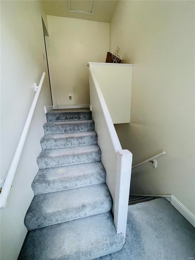 4926 W Florissant Ave, Saint Louis, MO 63115 - staircase with carpet and baseboards