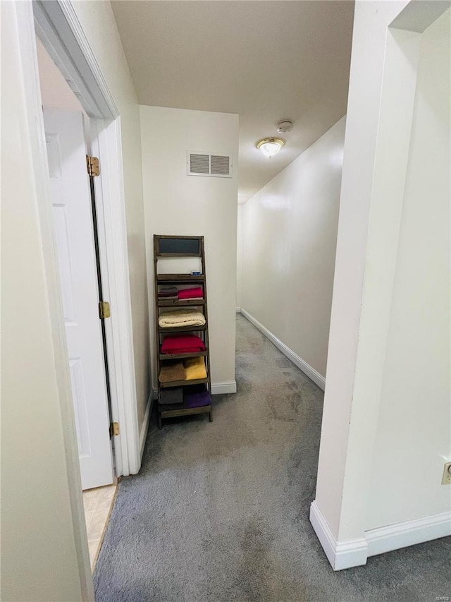 4926 W Florissant Ave, Saint Louis, MO 63115 - corridor featuring carpet floors and baseboards