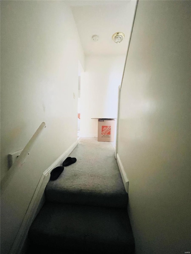 4926 W Florissant Ave, Saint Louis, MO 63115 - staircase featuring carpet floors and baseboards