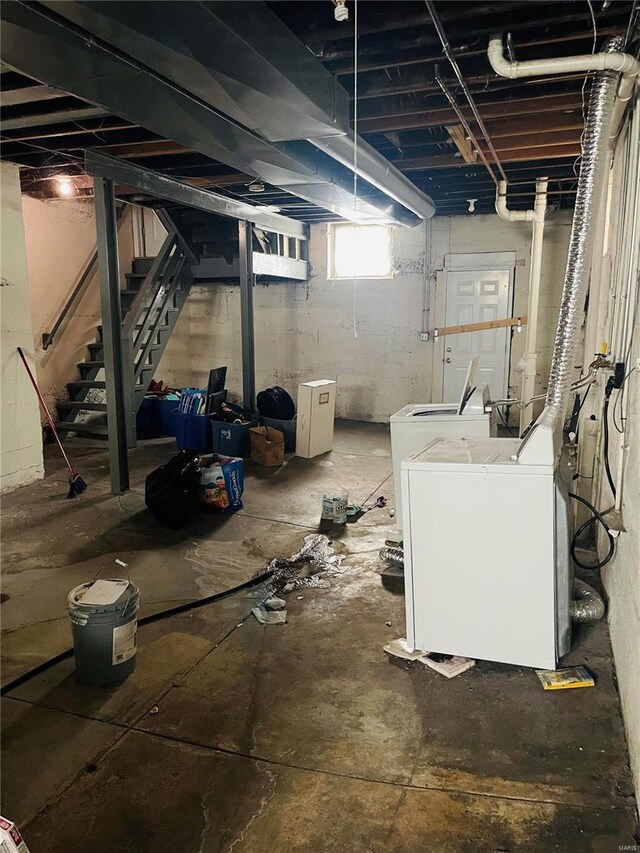 4926 W Florissant Ave, Saint Louis, MO 63115 - below grade area with stairs and washing machine and clothes dryer