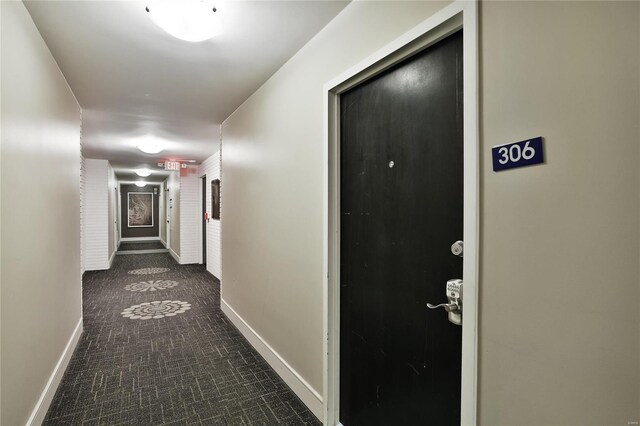 hallway featuring baseboards