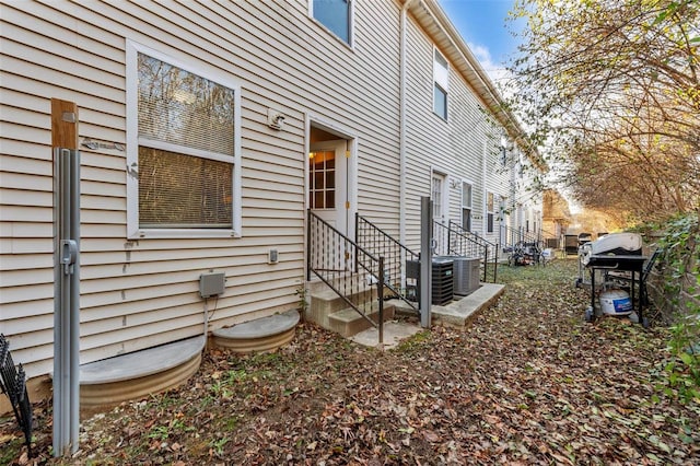 1443 Alberta Dr, Saint Charles, MO 63303 - view of side of property with entry steps and central AC unit