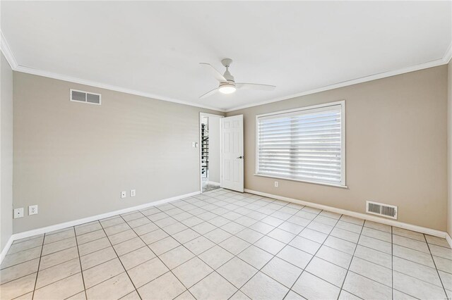spare room featuring ornamental molding, a ceiling fan, baseboards, and light tile patterned flooring