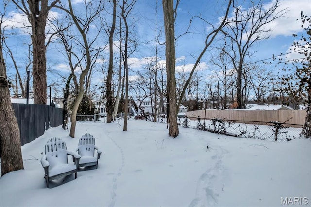 6522 Crest Ave, Saint Louis, MO 63130 - yard layered in snow featuring fence