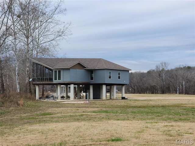 2358 Brown Rd, Van Buren, MO 63965 - view of front of home featuring a sunroom, a front lawn, and roof with shingles