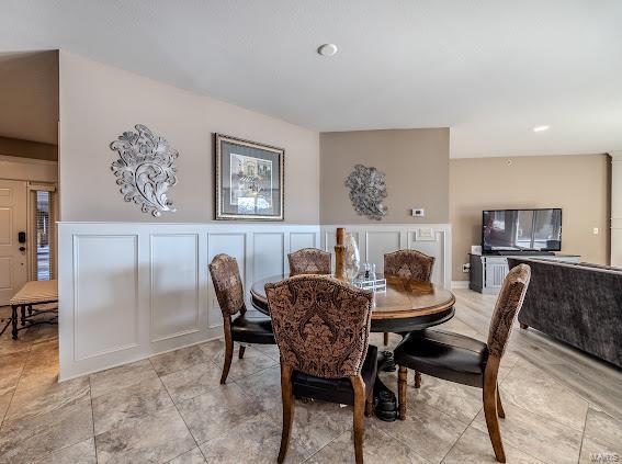 dining area featuring light tile patterned floors