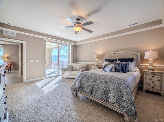 bedroom featuring access to exterior, carpet flooring, ceiling fan, and baseboards