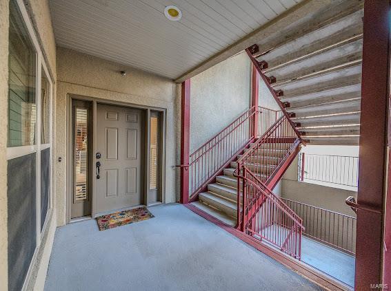 view of exterior entry featuring stucco siding