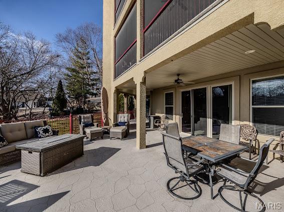 3168 Twin Rivers Pt, Camdenton, MO 65420 - view of patio / terrace with an outdoor living space, outdoor dining area, and a ceiling fan