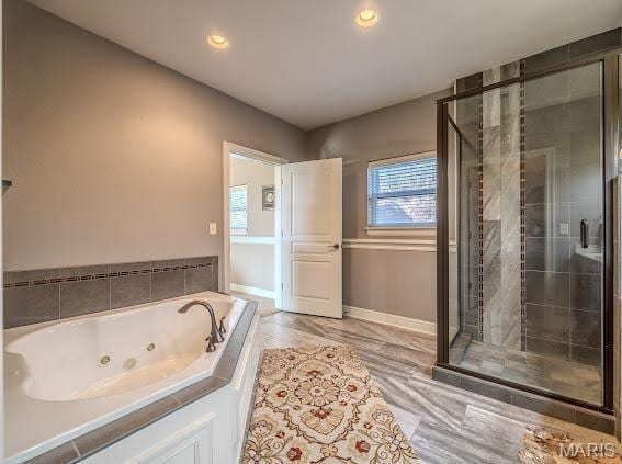 3168 Twin Rivers Pt, Camdenton, MO 65420 - bathroom featuring a whirlpool tub, a shower stall, baseboards, and recessed lighting