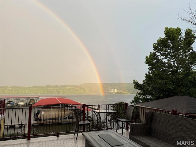 3168 Twin Rivers Pt, Camdenton, MO 65420 - view of patio with a water view and a balcony