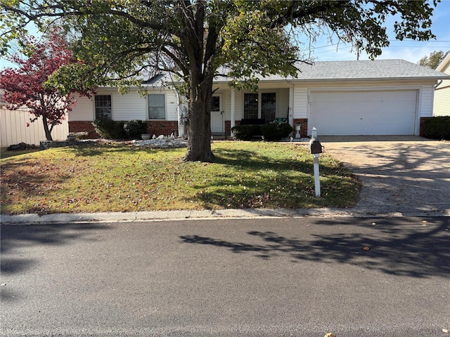 ranch-style house with brick siding, driveway, an attached garage, and a front lawn