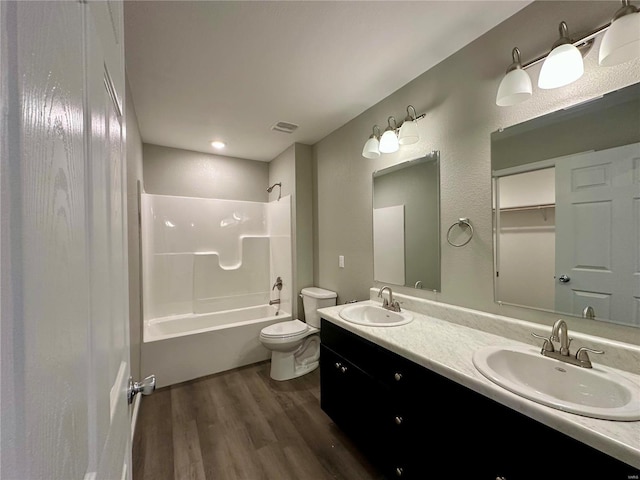 16 N Herren Ave, Ellsinore, MO 63937 - full bath featuring wood finished floors, shower / washtub combination, toilet, and double vanity