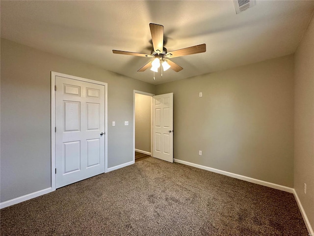 16 N Herren Ave, Ellsinore, MO 63937 - unfurnished bedroom with carpet flooring, baseboards, and a ceiling fan