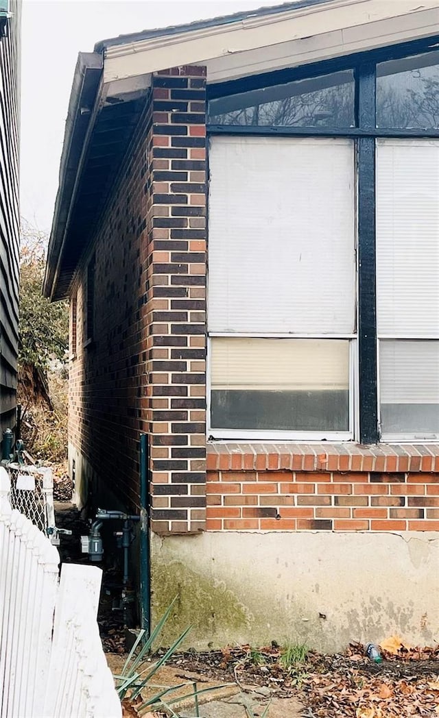 4610 Lexington Ave, Saint Louis, MO 63115 - view of side of property featuring brick siding and fence
