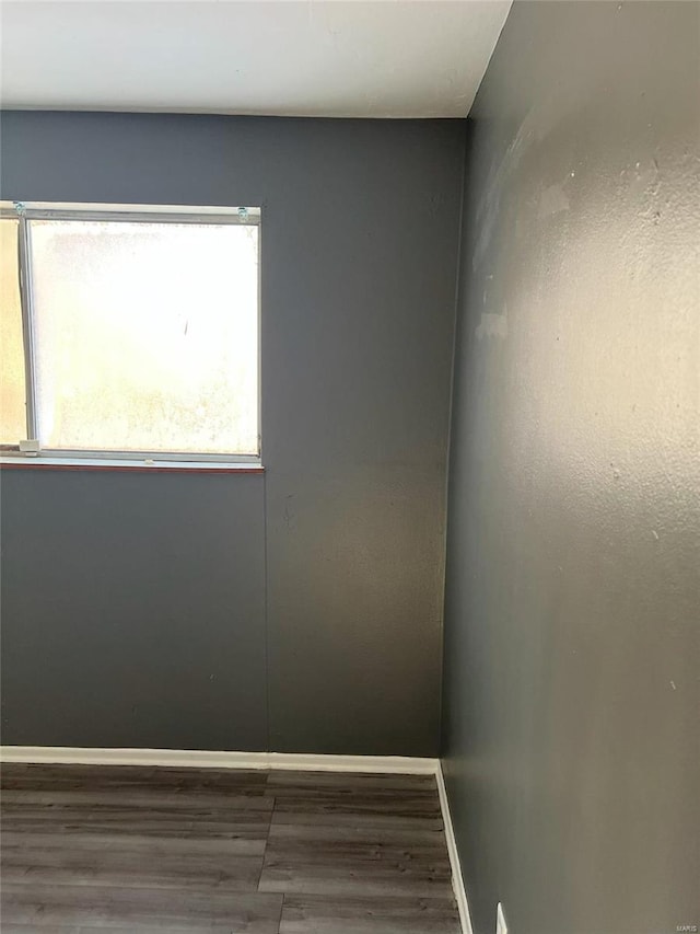 4610 Lexington Ave, Saint Louis, MO 63115 - empty room with wood finished floors and baseboards