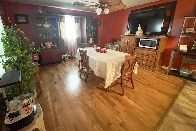 9667 State Highway 25 S, Dexter, MO 63841 - dining space with light wood-style flooring and ceiling fan