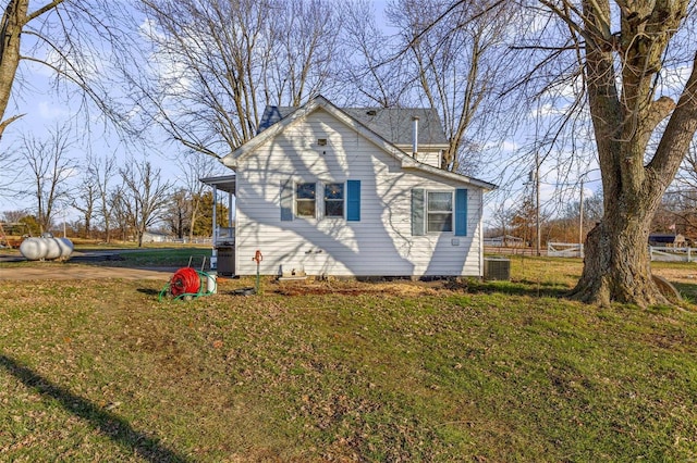 10751 State Route F, Farmington, MO 63640 - view of property exterior with a lawn and central AC unit