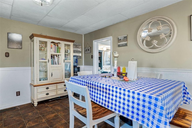 10751 State Route F, Farmington, MO 63640 - tiled dining space featuring wainscoting and a drop ceiling