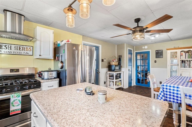 10751 State Route F, Farmington, MO 63640 - kitchen featuring appliances with stainless steel finishes, ventilation hood, ceiling fan, white cabinetry, and a paneled ceiling