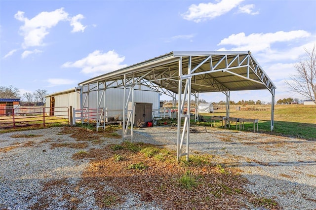 10751 State Route F, Farmington, MO 63640 - view of parking / parking lot with a detached carport and fence