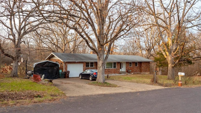 989 Clay St, Saint Clair, MO 63077 - ranch-style house with brick siding, a garage, driveway, and a detached carport