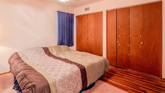 989 Clay St, Saint Clair, MO 63077 - bedroom featuring multiple closets and wood finished floors