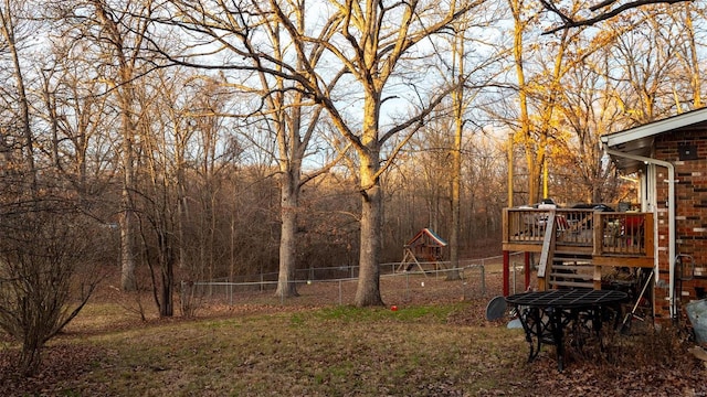 989 Clay St, Saint Clair, MO 63077 - view of yard featuring a playground, a wooden deck, and fence