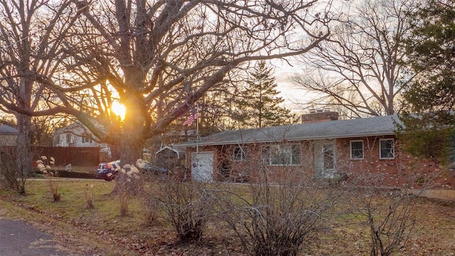 989 Clay St, Saint Clair, MO 63077 - rear view of property featuring a chimney, brick siding, and fence