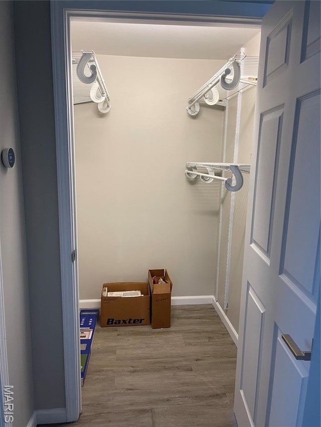 3305 Fee Fee Rd, Bridgeton, MO 63044 - detailed view of wood finished floors and baseboards