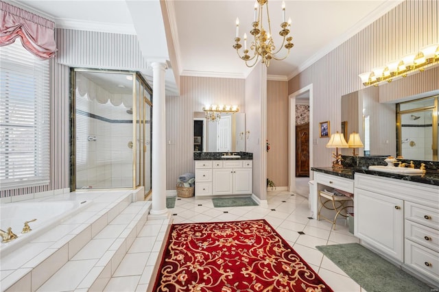 bathroom with a chandelier, ornamental molding, a stall shower, a garden tub, and ornate columns