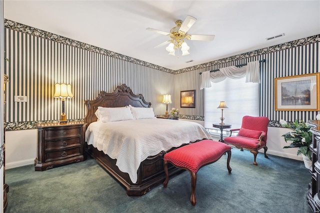 carpeted bedroom with baseboards and a ceiling fan