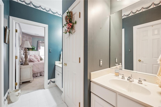 bathroom featuring ensuite bath and vanity