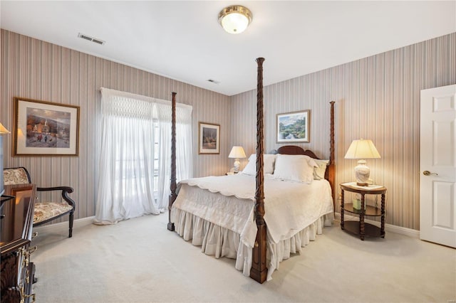 bedroom featuring carpet floors, wallpapered walls, and baseboards