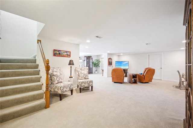 living area with carpet floors, recessed lighting, stairs, and baseboards