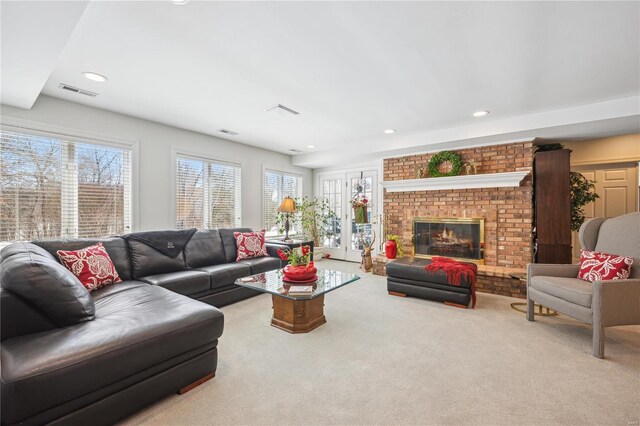 living area with healthy amount of natural light, carpet flooring, a fireplace, and recessed lighting