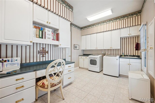 19385 Deer Pointe Estates Dr, Wildwood, MO 63038 - washroom with washer and dryer, cabinet space, wallpapered walls, and light tile patterned flooring