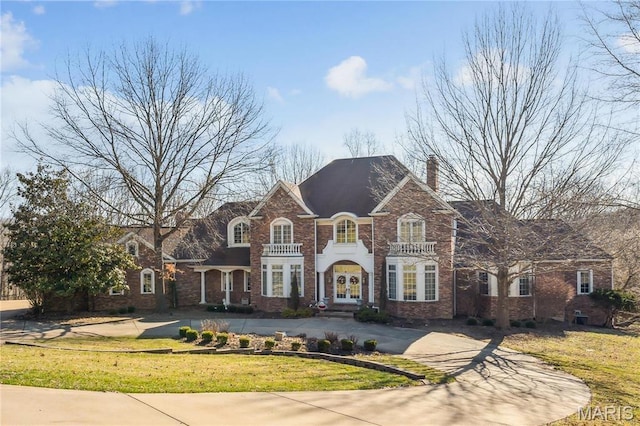 19385 Deer Pointe Estates Dr, Wildwood, MO 63038 - georgian-style home featuring a front yard, french doors, and a chimney
