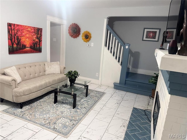 3511 Oakdale Ave, Saint Louis, MO 63121 - living area with light marble finish floors, stairway, and baseboards