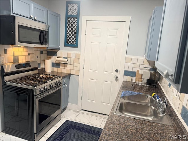 3511 Oakdale Ave, Saint Louis, MO 63121 - kitchen with appliances with stainless steel finishes, a sink, light marble finish flooring, and backsplash