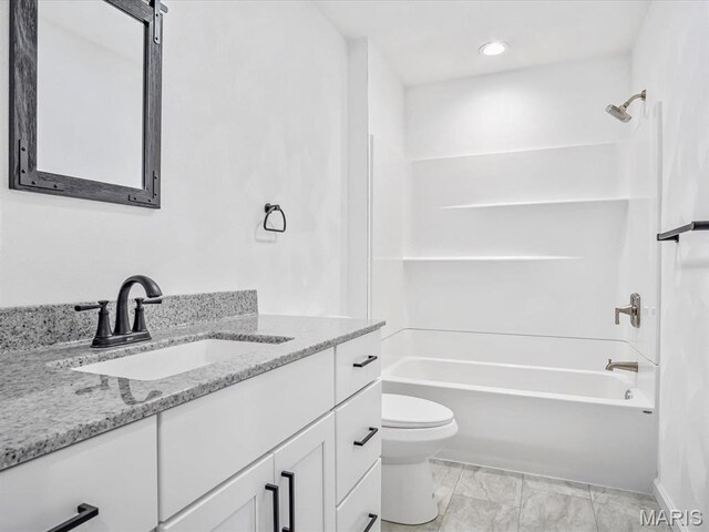 full bathroom featuring toilet, washtub / shower combination, and vanity
