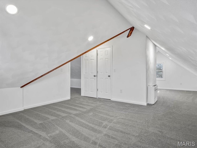 bonus room featuring carpet floors, lofted ceiling, baseboards, and recessed lighting