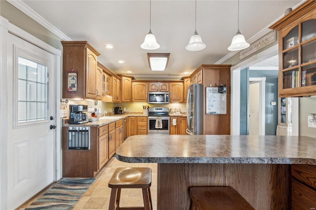 219 Cypress St, Park Hills, MO 63601 - kitchen featuring appliances with stainless steel finishes, a kitchen breakfast bar, glass insert cabinets, a sink, and ornamental molding