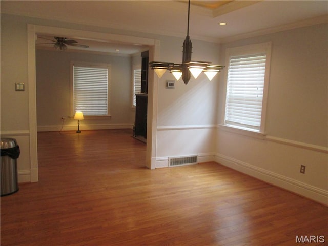 7939 Delmar Blvd Unit 1W, Saint Louis, MO 63130 - unfurnished dining area featuring crown molding, wood finished floors, baseboards, ceiling fan, and recessed lighting