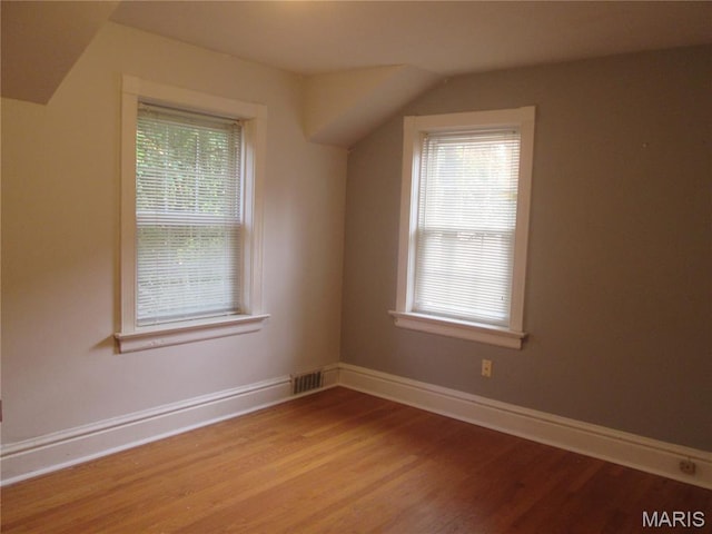 7939 Delmar Blvd Unit 1W, Saint Louis, MO 63130 - additional living space with healthy amount of natural light, light wood-type flooring, and baseboards