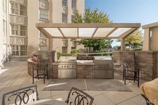 view of patio / terrace featuring an outdoor kitchen and grilling area