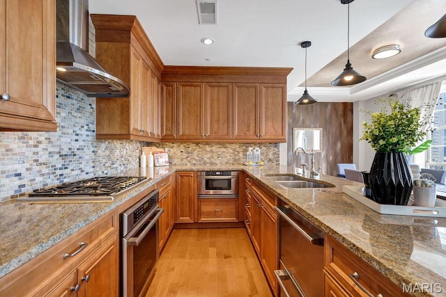 232 N Kingshighway Blvd Unit 1201, Saint Louis, MO 63108 - kitchen with a sink, wall chimney exhaust hood, appliances with stainless steel finishes, brown cabinets, and recessed lighting