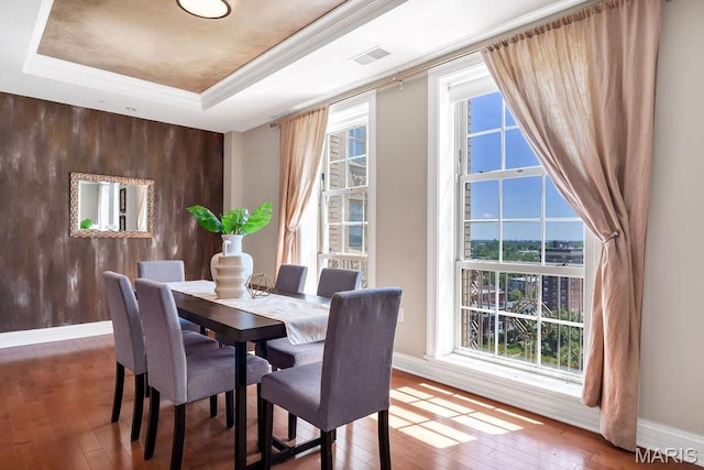 232 N Kingshighway Blvd Unit 1201, Saint Louis, MO 63108 - dining room featuring a tray ceiling, wood-type flooring, baseboards, and ornamental molding